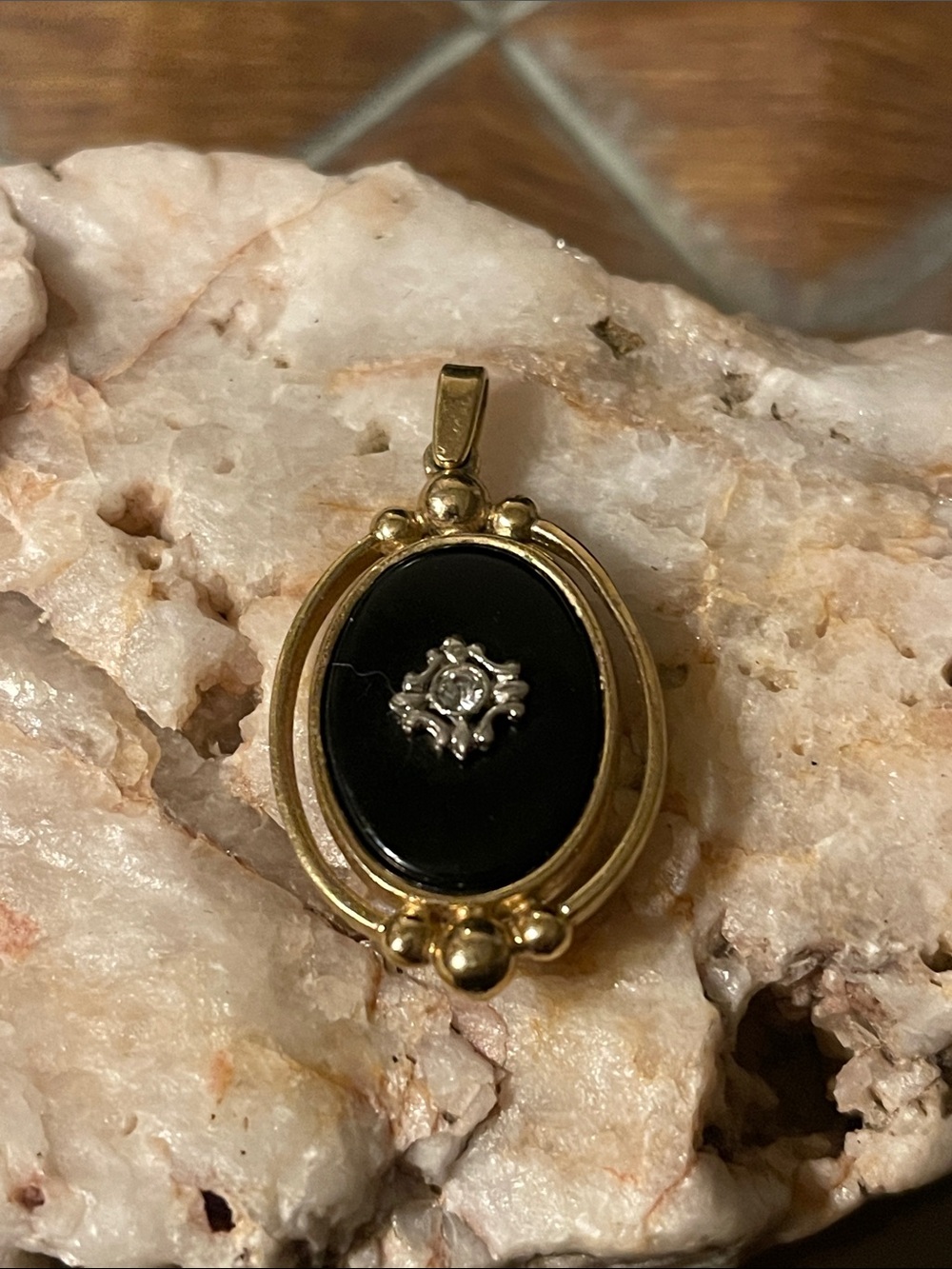 Avon Gold-Tone Pendant with Black Center and Silver Accent